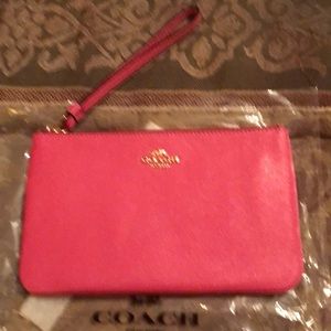 Large leather pink wristlet by Coach New